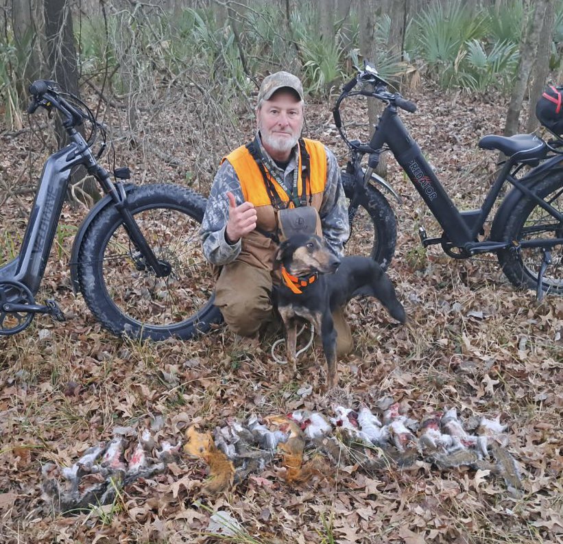 Hunter with ebike and day's squirrel harvest